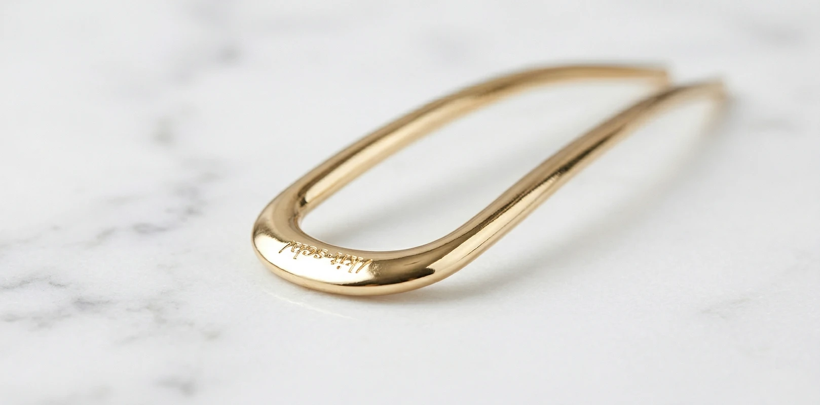 sleek gold French hair pin