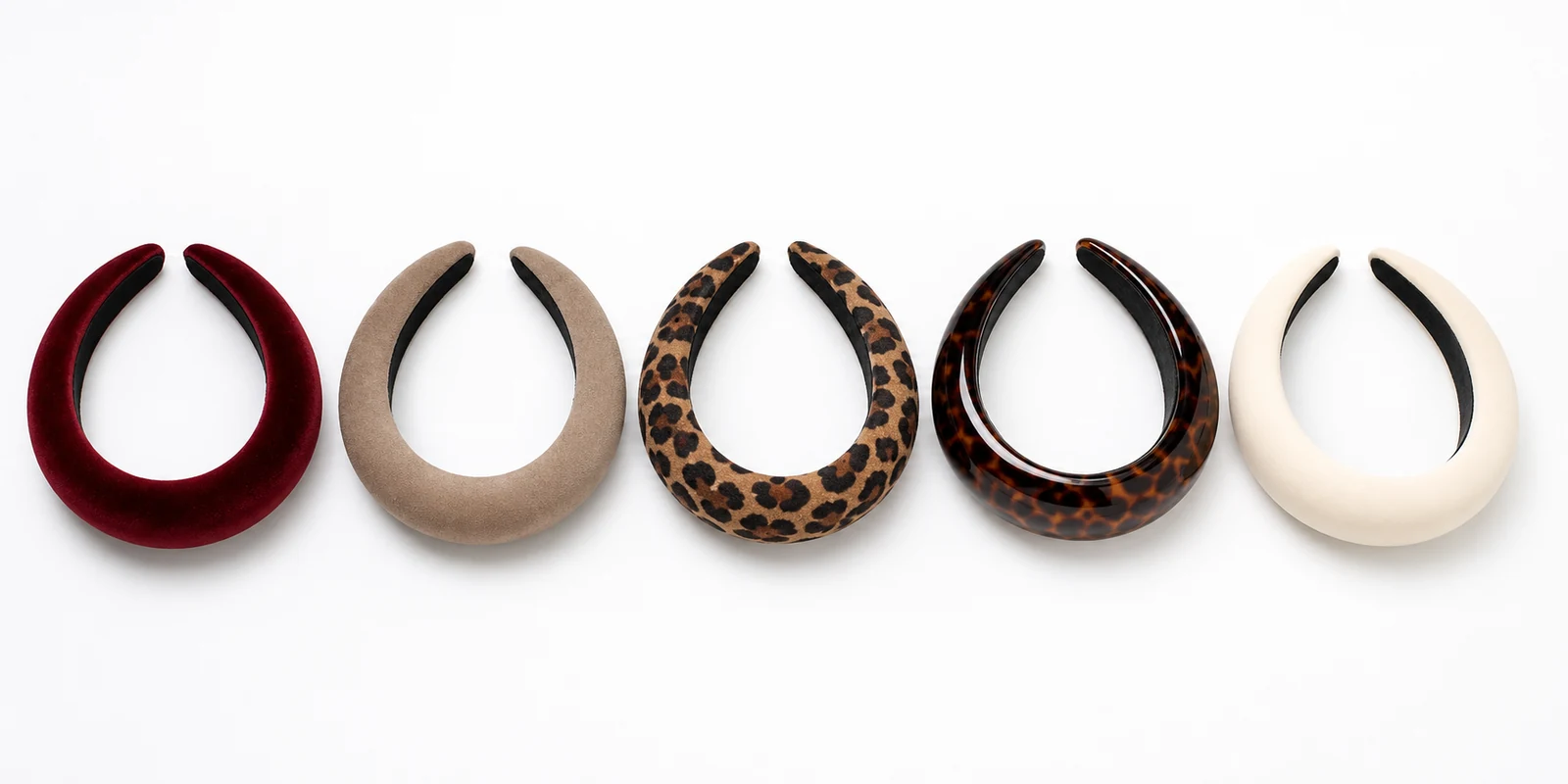 Collection of padded headbands in velvet, suede and leopard print showing the structured headband trend