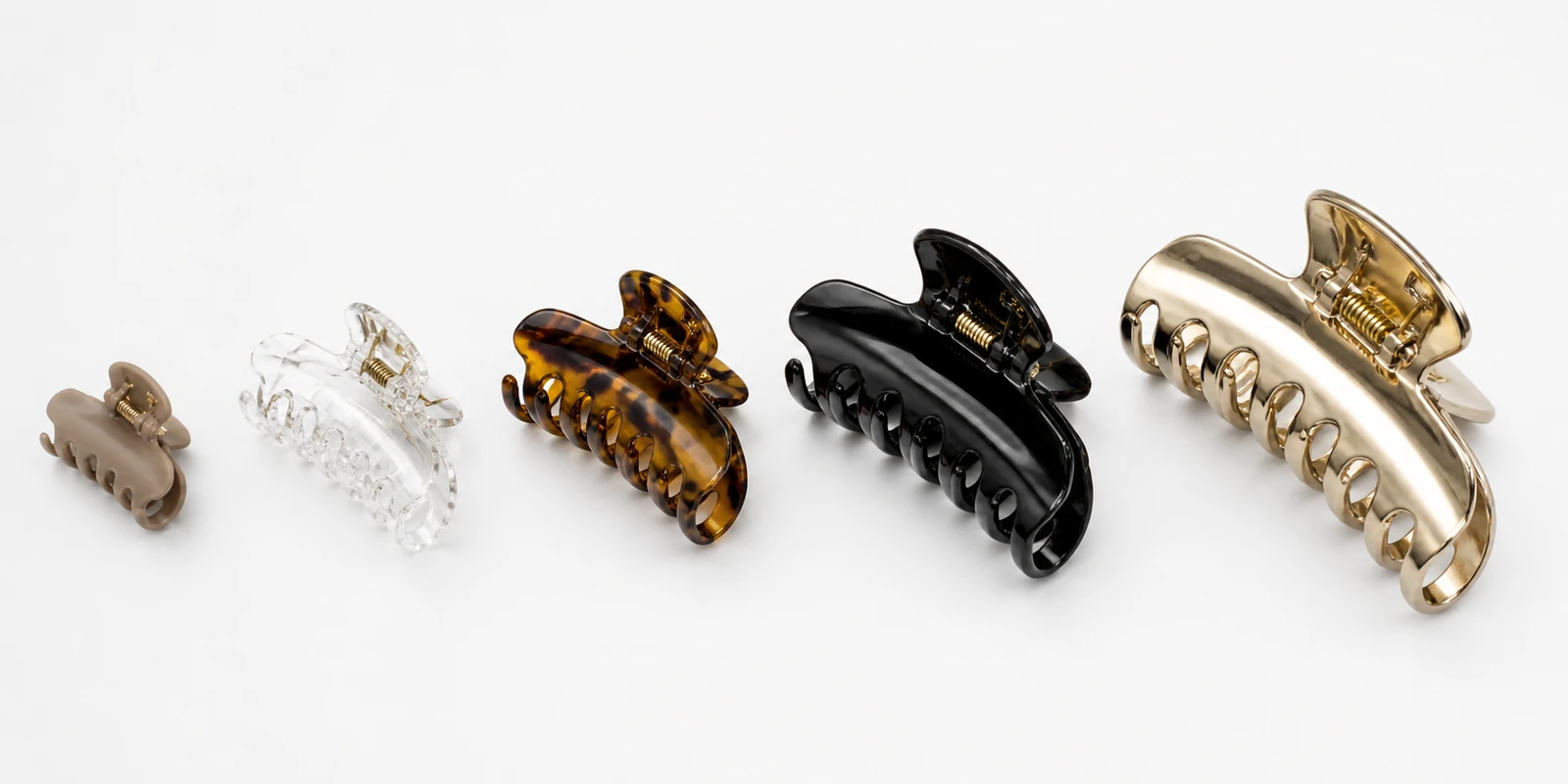 Range of claw clips in different sizes and materials showing the real variables that matter for sourcing