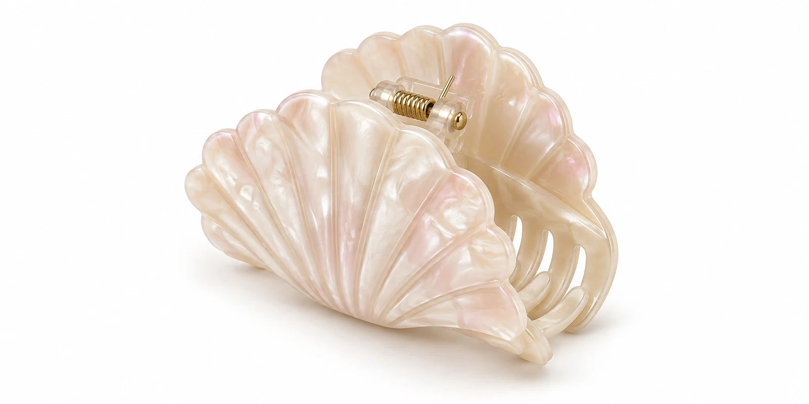 Claw clip moulded into a scallop shell silhouette in pearlescent finish