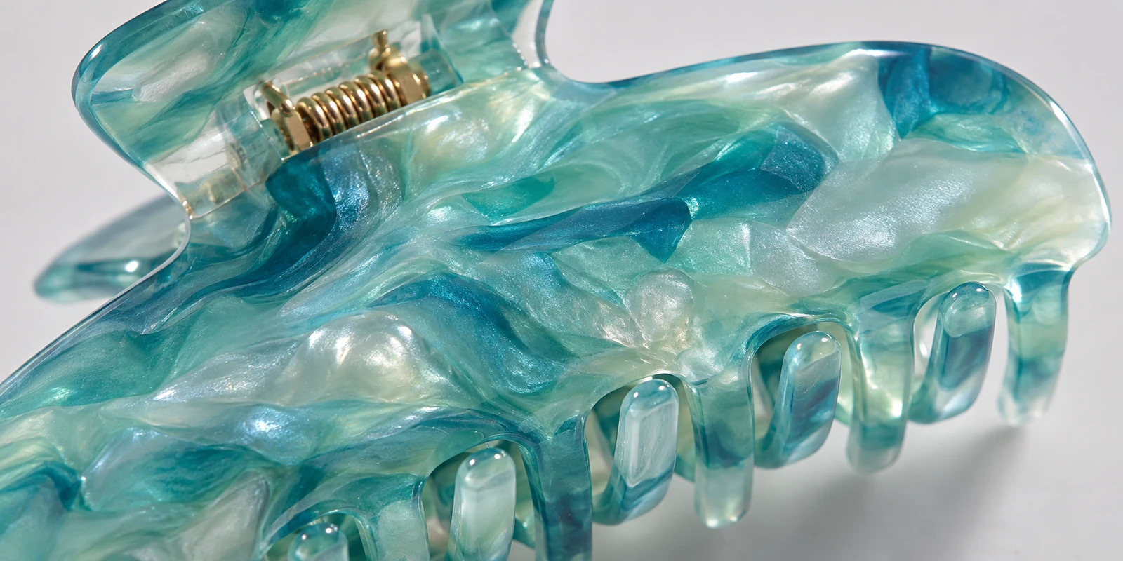 Close-up of translucent pearlescent acetate showing marbled sea-glass effect