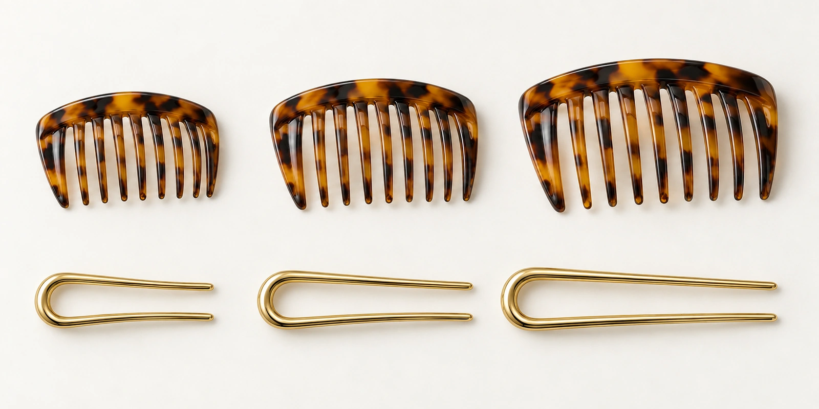 Three French side combs and three two-prong hair forks arranged from small to large