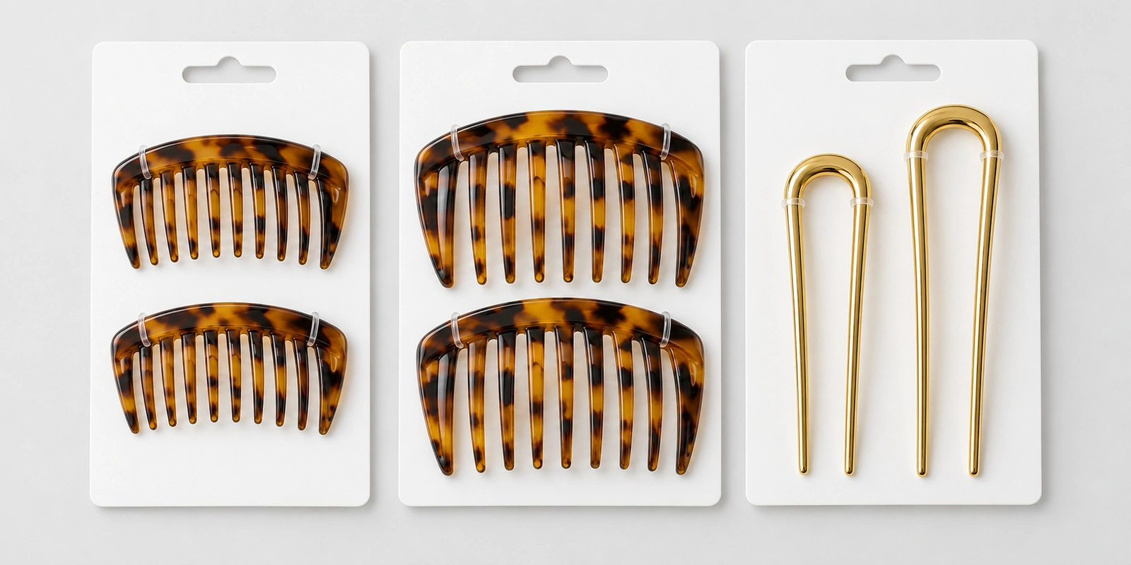 Coordinated tortoiseshell side comb pairs and gold hair forks on blank retail backing cards